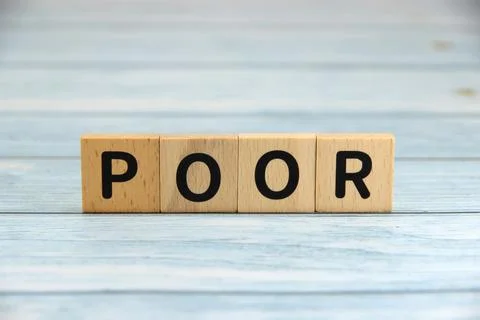 "POOR" text or message short word english letter on wooden cubes block with.. Stock Photos