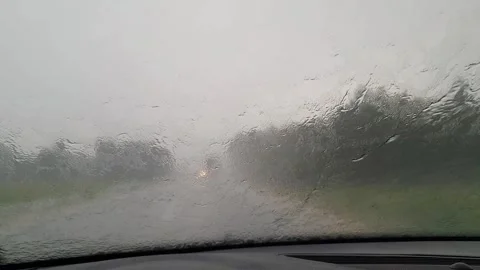 Poor visibility while driving a car during heavy rain. Video stock 246912089