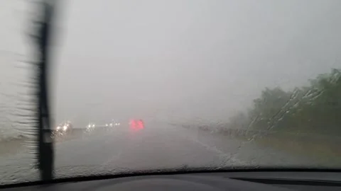 Poor visibility while driving a car during heavy rain. Video stock 246912460