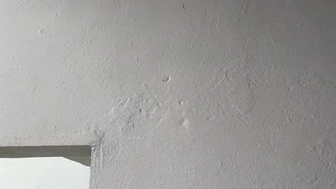 Poor Wall Plaster Work on Building | Uneven and Weak Plaster on House Wall Stock Footage 315625113