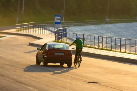 Poor wanderer, catching the wind and passing cars Stock Photos
