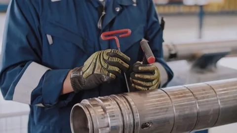 Poor work. Not following safety regulations. The worker drops the tool. Stock Footage 316320845