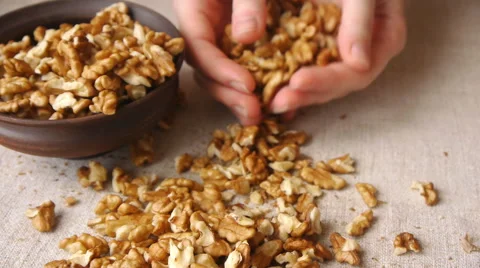 Pooring Walnut Kernels Into The Ceramic Bowl Stock Footage 67332466