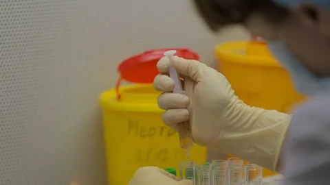 Poorly equipped field laboratory takes virus test, samples tested, biochemistry Stock Footage 128643272