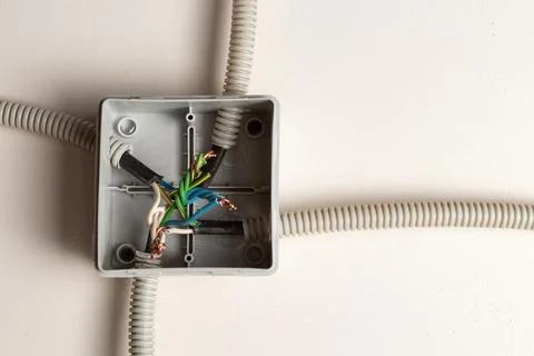 Poorly installed electrical wires in the junction box Stock Photos