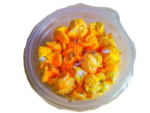 Pop corn in a transparent plastic container on a white background Foto stock