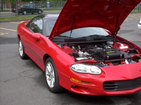 Pop the hood on that Camaro Stock Photos