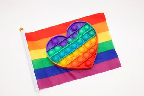 Pop it toy on the rainbow flag Stock Photos