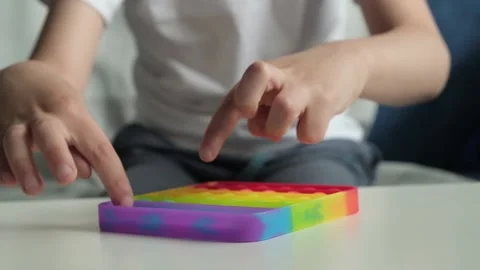 Pop it Toys Simple dimple. Boy push pop it. Stock Footage 156358904