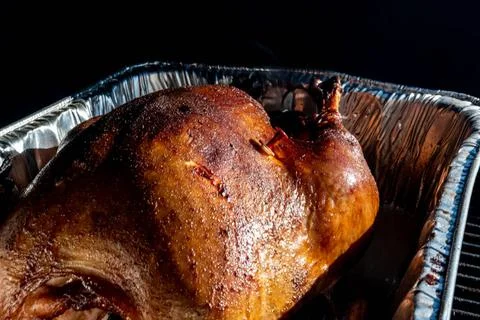 Pop-up thermometer timer in a smoked turkey Turkey in a pan sitting in a s... Stock Photos