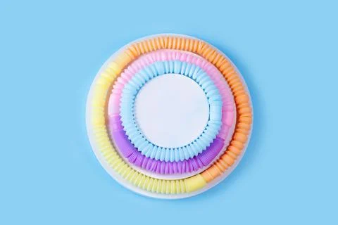 Pop tubes circle composition in the form of a cake. Stock Photos