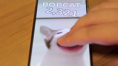 Popcat game being played by tapping finger on cat on modern smartphone Stock-Footage 158935624