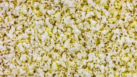 Popcorn background. Top view and closeup rotation. Stock Footage 76589378