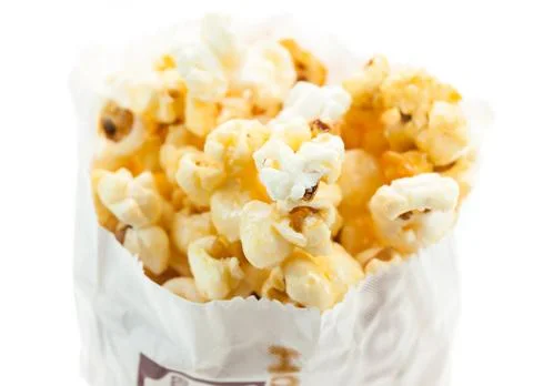 Popcorn in bag on white background Stock Photos