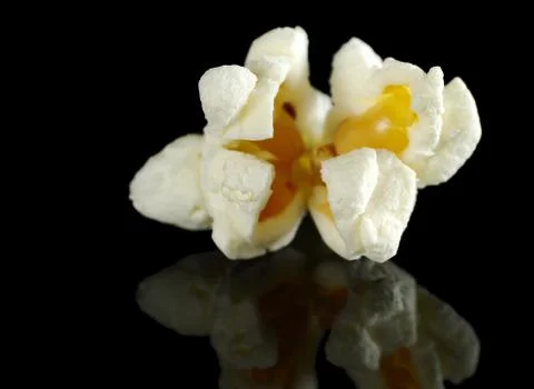 Popcorn on black Stock Photos