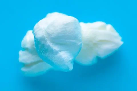Popcorn on a blue background. Macro image of popcorn Stock Photos