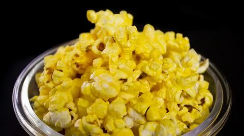 Popcorn in a bowl with black background - Closeup view Stock Photos