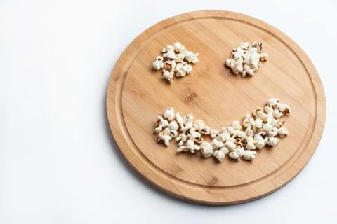 Popcorn in bowl on white background Stock Photos