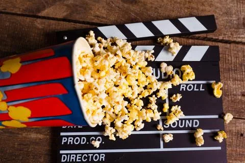 Popcorn box with clapper board Stock Photos