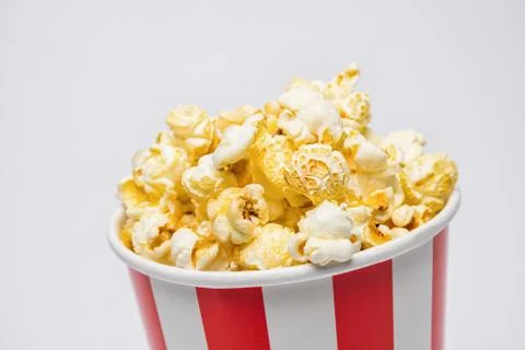 Popcorn in a box on gray background Фото