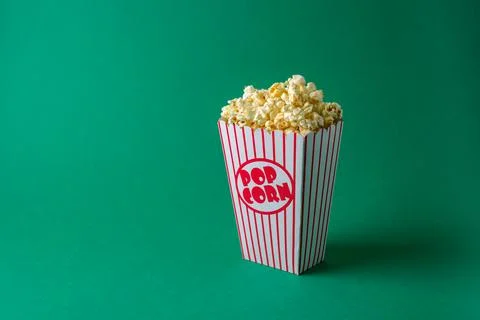 Popcorn box on green Stock Photos