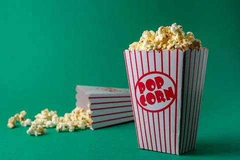 Popcorn box on green Stock Photos