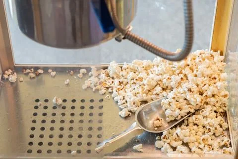 Popcorn in a box machine and spoon Stock Photos