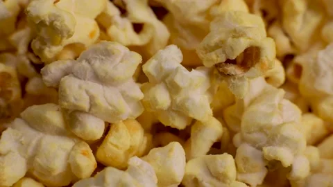 Popcorn close-up, macro rotates, snacks in the cinema Stock Footage 227359097