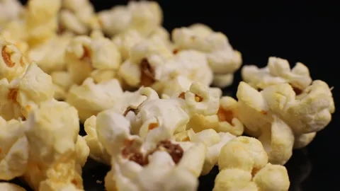Popcorn close-up, macro rotates, snacks in the cinema Stock Footage 227359612