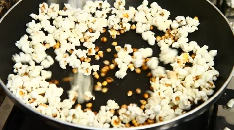 Popcorn cooking in a pan Stock Footage 46937451