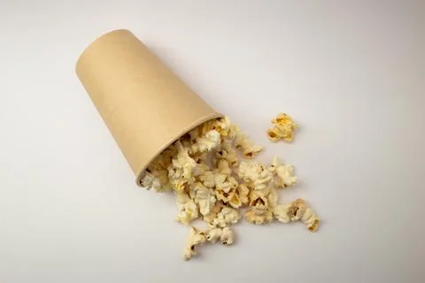 Popcorn in a cup on a white background Stock Photos