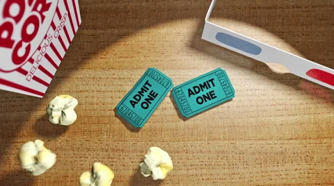 Popcorn drops onto a counter with 3d glasses and movie tickets Stock Footage 48972762