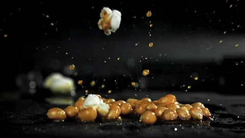 Popcorn explodes in the pan. Filmed on a high-speed camera at 1000 fps. Stock Footage 308462046