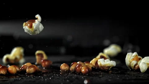 Popcorn explodes in the pan. Filmed on a high-speed camera at 1000 fps. Stock Footage 308462082