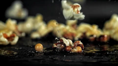 Popcorn explodes in the pan. Filmed on a high-speed camera at 1000 fps. Stock Footage 308462713