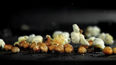 Popcorn explodes in the pan. Filmed on a high-speed camera at 1000 fps. Stock Footage 308462835