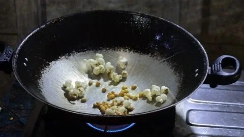 Popcorn explodes in the pan. HD videos. Stock Footage 213926821