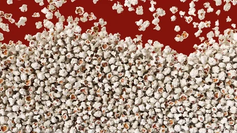 Popcorn falling down from top and fill red background. Видео 98637066