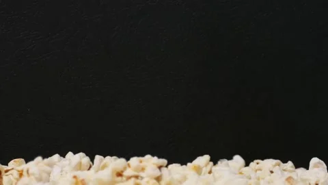 Popcorn falling on pile Stockbeeldmateriaal 237497768