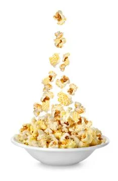 Popcorn falling in the plate Stock Photos