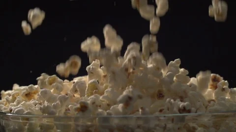 Popcorn falling pouring in bowl Slow motion Stock Footage 107939064