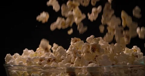 Popcorn falling pouring in bowl Slow motion video Stock Footage 108776045