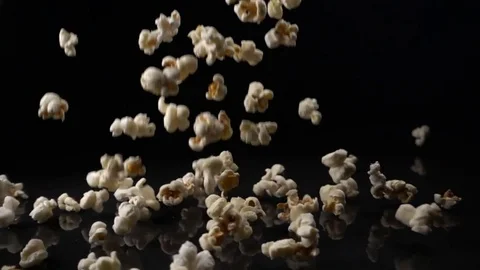 Popcorn falls on a black surface 스톡 동영상 73680709