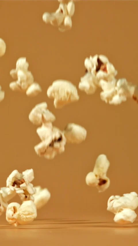 Popcorn falls on the table. Filmed on a high-speed camera at 1000 fps Stock Footage 335356981