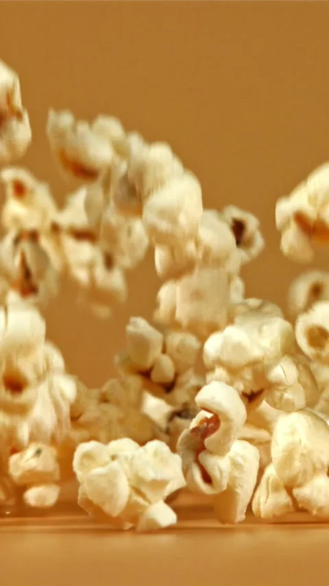 Popcorn falls on the table. Filmed on a high-speed camera at 1000 fps Stock Footage 335357151