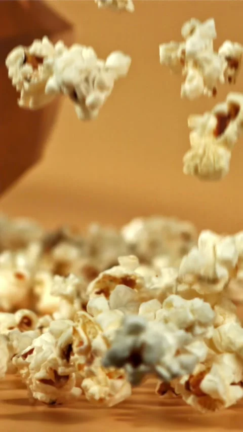 Popcorn falls on the table. Filmed on a high-speed camera at 1000 fps Stock Footage 335358371