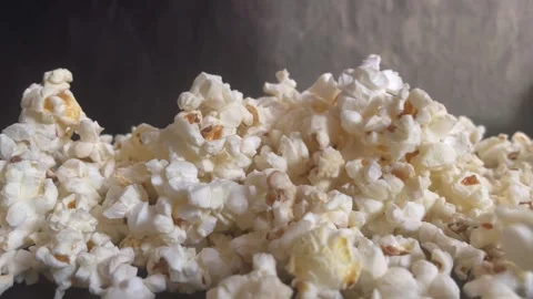 Popcorn falls on the table Stock Footage 245562700