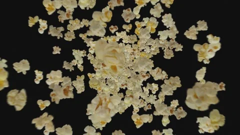 Popcorn flies on black background Stock Footage 297302930