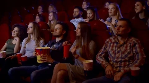 Popcorn forever. Closeup cropped shot of a happy smiling woman grabbing popcorn 스톡 동영상 75037055