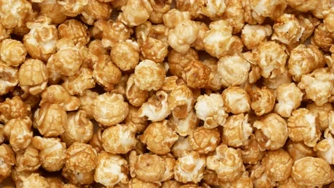 Popcorn in glaze, top view. Popcorn balls, dolly shot. Stock Footage 146273142